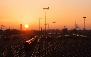 Train yard sunset cityscape bridge - a train free wallpaper