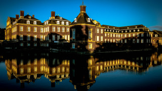 Large building clock tower reflection 2 - a reflection of the building free wallpaper