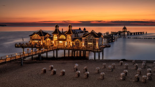 Pier building night lights romanticism - a pier free wallpaper