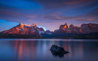 Mountain lake rock sunset clouds - a sunset in the background free wallpaper
