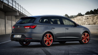 Grey car red rims parking - a bridge and a building free wallpaper