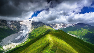 Mountain range green field cloudy - a green field below free wallpaper