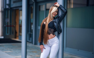 Woman black jacket white pants - flowing hair free wallpaper