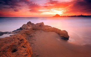 Rock water sunset mountain clouds - a mountain in the background free wallpaper for desktop
