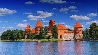 Castle lake boat orange turrets - romanesque free wallpaper