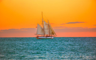 Sailboat sunset water bridge cityscape - impressionist free wallpaper