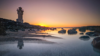 Lighthouse rocky shore sunset ocean 3 - a rocky shore free wallpaper