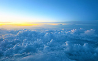 Sky clouds sun mountains ocean - cloud below free wallpaper