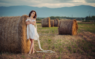Woman white dress hay bale 2 - daphne mcclure free wallpaper