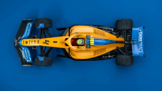 Yellow race car blue background - a black stripe free wallpaper