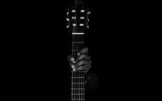 Person holding guitar dark black - their hand in free wallpaper