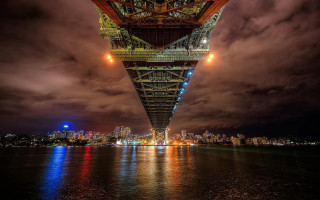 Tall bridge lights city skyline - side and a city in the background free wallpaper