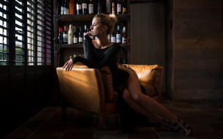 Woman sitting wine bottle fashion - her hand and a bottle of wine free wallpaper