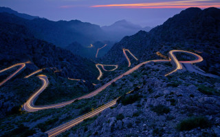 Winding road lights mountains night - road free wallpaper