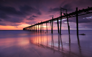 Pier beach purple sunset clouds - rich moody colour free wallpaper