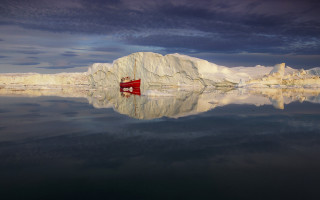 Boat icebergs mountains sunset water - a cloudy sky free wallpaper