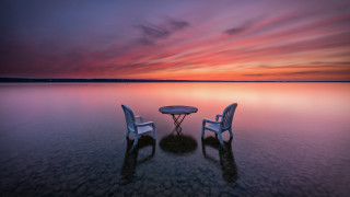 Beach sunset table chairs ocean - a photorealistic painting free wallpaper for desktop