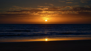 Sunset ocean beach figure gradient - a photo free wallpaper