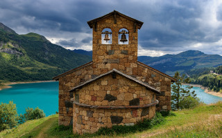 Rocky church lake mountains clouds - a church free wallpaper