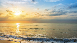 Sunset ocean island clouds sky - a small island in the distance free wallpaper