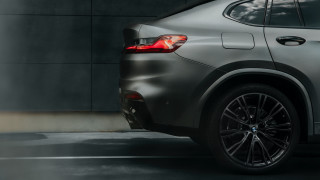 Silver bmw suv cloudy sky - a black car in the foreground free wallpaper