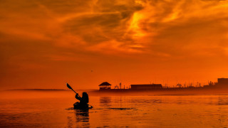 Kayak sunset cityscape fire clouds - a body of water free wallpaper