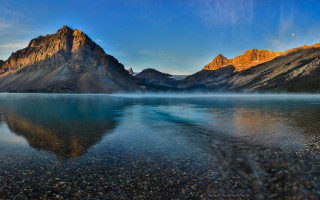 Mountain reflection lake shore sky - the water of a lake free wallpaper