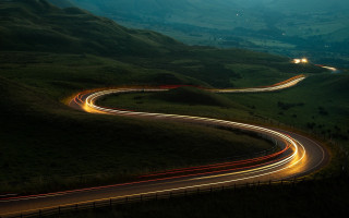 Winding road light trail mountains - road free wallpaper