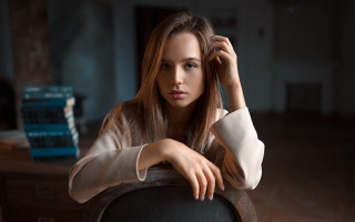 Woman blonde sitting books portrait - her arm free wallpaper