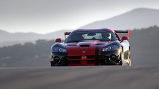 Red black sports car mountains 2 - foggy sky above free wallpaper
