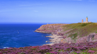 Lighthouse cliff ocean sailboat sunny - the water below free wallpaper