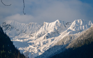 Snowy mountain trees clouds landscape - the side of it free wallpaper