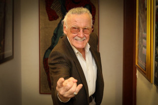 Man suit glasses pointing smiling - his face free wallpaper