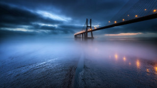 Foggy night bridge lights reflection - a long bridge free wallpaper