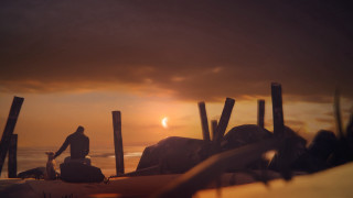 Beach man sunset ruins silhouette - a wooden post free wallpaper
