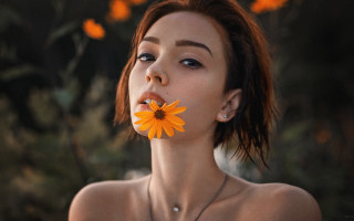 Woman flower necklace portrait brown - elina karimova free wallpaper