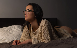 Woman bed blurry fishnets glasses - her back free wallpaper