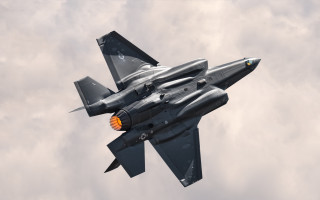 Fighter jet cloudy sky light - the other side free wallpaper