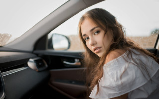Serious woman car window brown - portrait photography free wallpaper