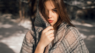 Woman coat snow portrait winter - her head and a hand free wallpaper