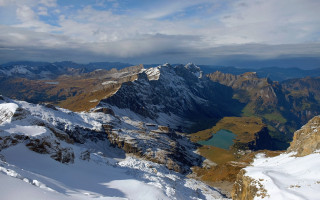 Mountain lake snowy horizon ocean - a view of a mountain range free wallpaper