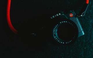 Camera red strap black surface - elsa bleda free wallpaper