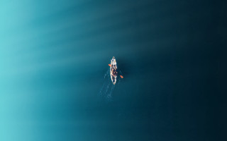 Ocean paddleboat minimalism tranquil microscopic - a microscopic photo free wallpaper