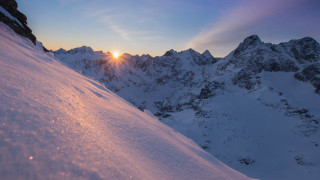 Snowboarder sunset mountains lake cityscape - a snowboard free wallpaper