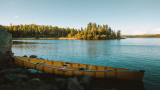 Yellow canoe rock lake forest - lake free wallpaper