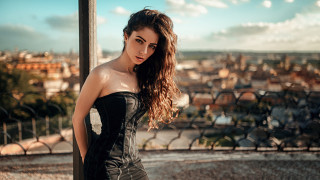 Woman corset balcony cityscape river - a balcony free wallpaper