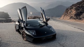 Black sports car mountains cloudy - its door free wallpaper