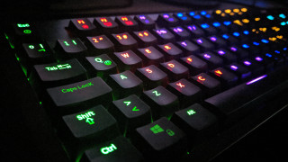 Keyboard glowing pad black background - a close up of a keyboard free wallpaper