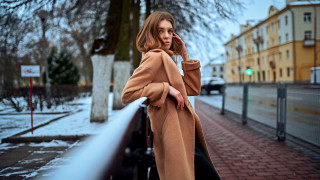 Woman coat cellphone snowy city - building free wallpaper
