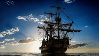 Sailing ship ocean sunset clouds - a sunbeam free wallpaper